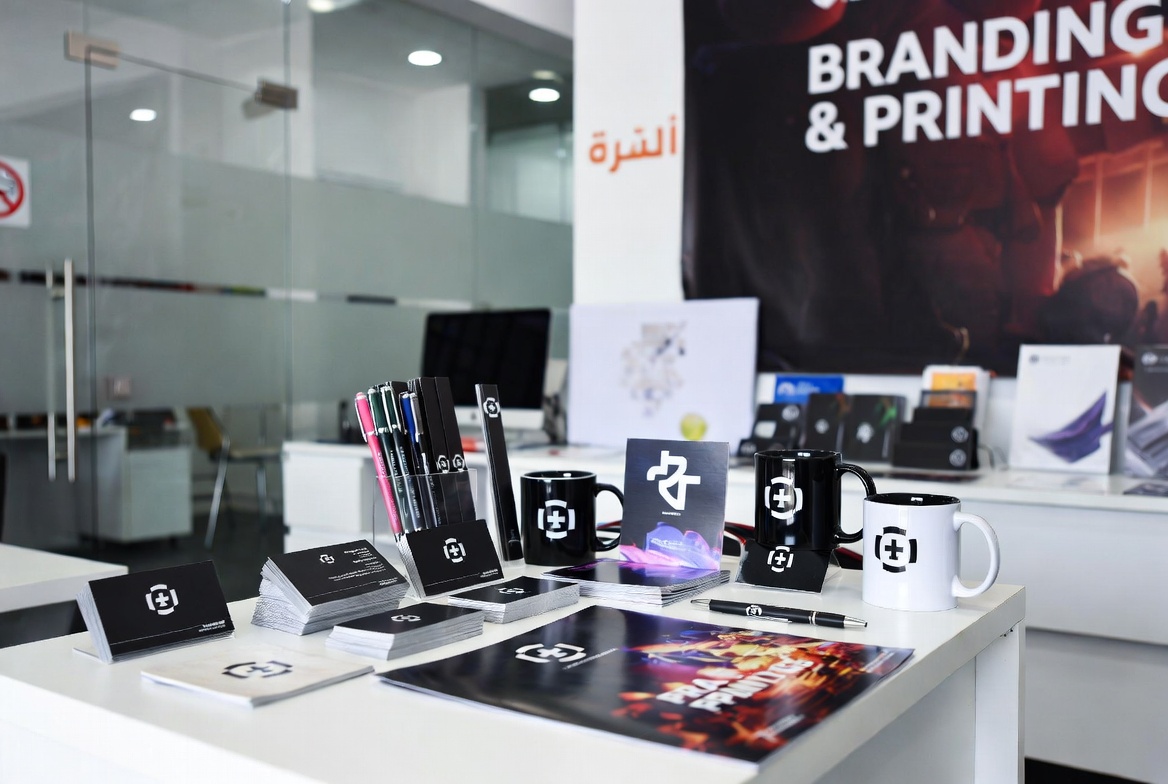 Rabtora Madhyam Management team reviewing outdoor media and signage plans in a Dubai office